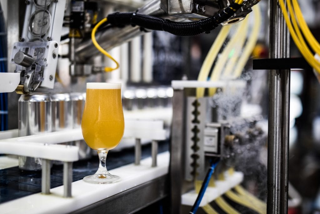 Automated filling machinery on a production line